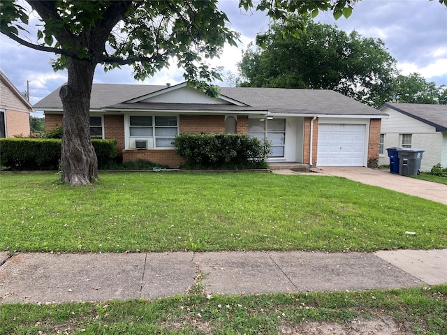 single story home featuring a garage and a front yard