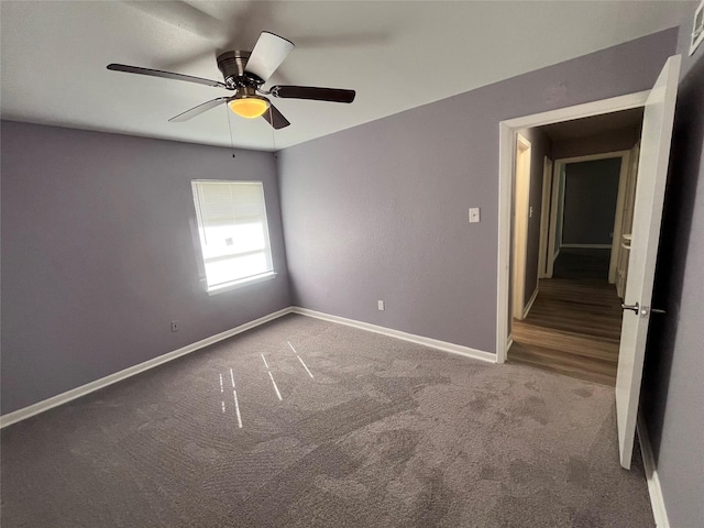 unfurnished room with carpet flooring and ceiling fan