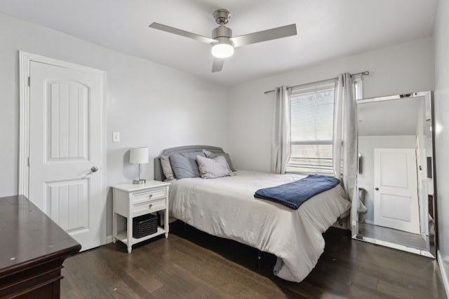 bedroom featuring dark wood-type flooring and ceiling fan