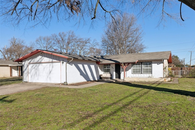 view of front of house with a front yard and a garage