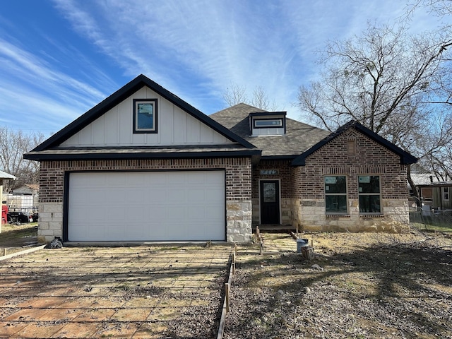 612 N US Highway 69, Celeste, TX 75423 - view of front of property featuring driveway, stone siding, brick siding, and a shingled roof