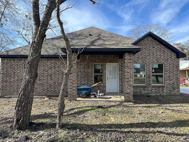 612 N US Highway 69, Celeste, TX 75423 - back of property with brick siding and a shingled roof