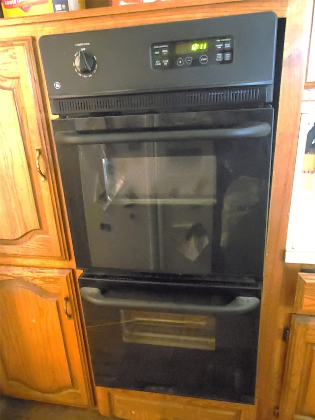 interior details featuring black double oven