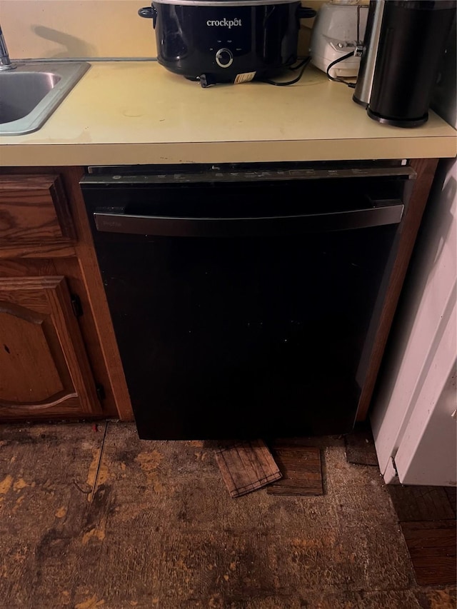 details with black dishwasher, sink, and dark brown cabinetry