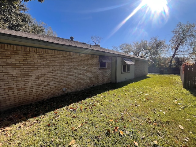 view of home's exterior featuring a yard