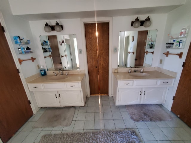 bathroom featuring tile patterned floors and vanity