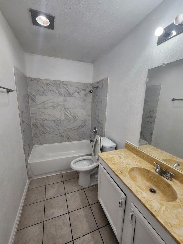 full bathroom with vanity, tiled shower / bath, tile patterned flooring, toilet, and a textured ceiling