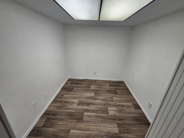 unfurnished room with dark hardwood / wood-style floors