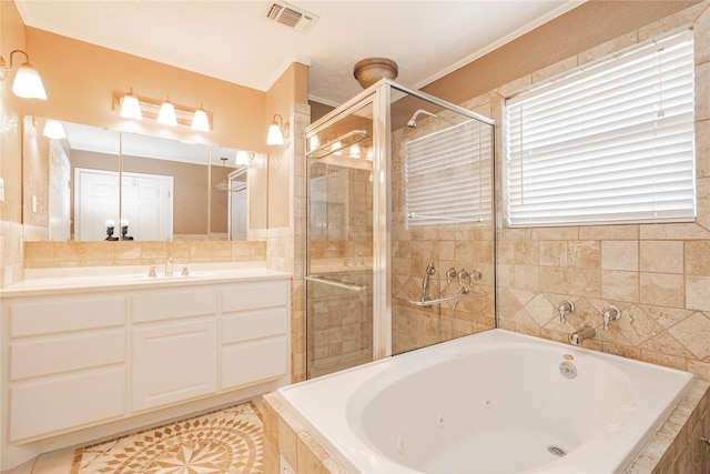 bathroom with visible vents, a whirlpool tub, a stall shower, and vanity