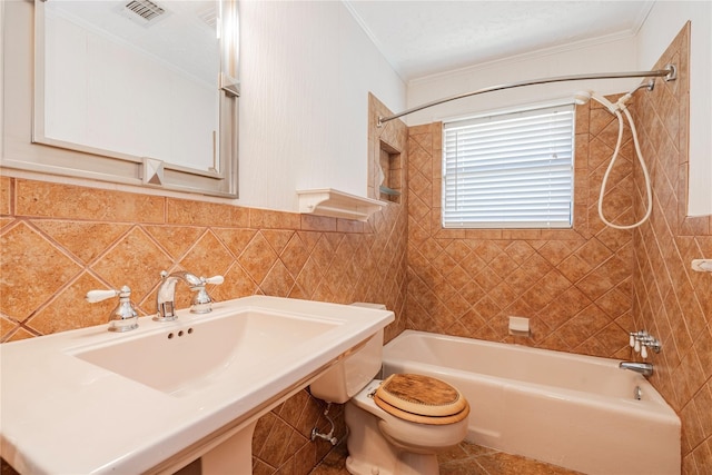 bathroom with ornamental molding, visible vents, toilet, and shower / bathing tub combination