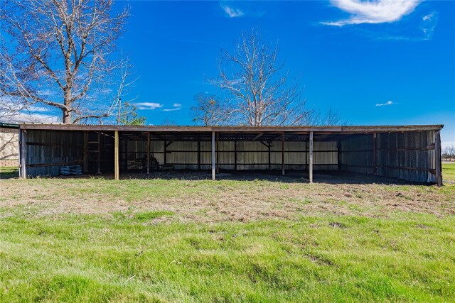 view of outdoor structure with a yard