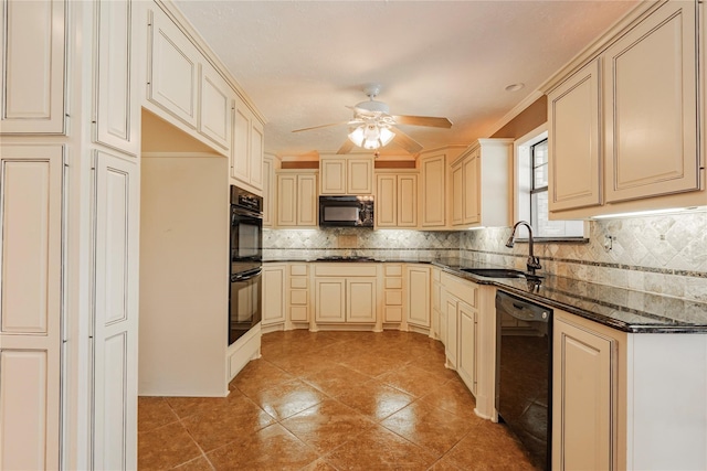 kitchen featuring a sink, black appliances, and cream cabinets