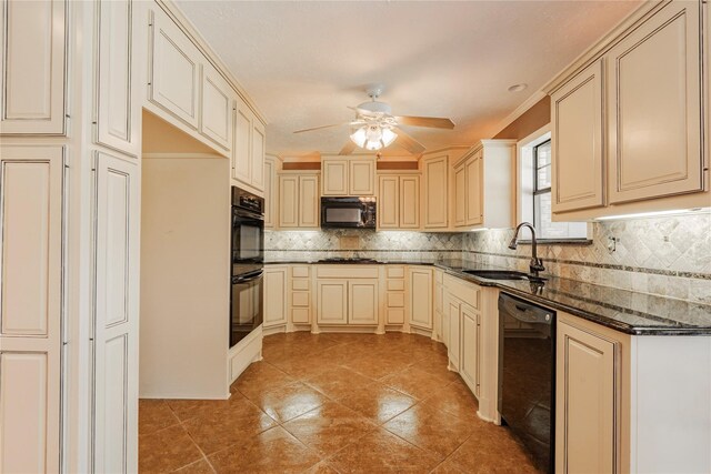 kitchen featuring tasteful backsplash, sink, dark stone countertops, and black appliances