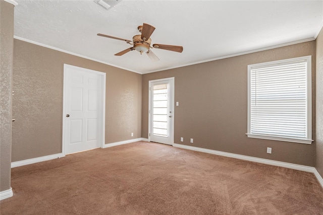 unfurnished room with ornamental molding, ceiling fan, light colored carpet, and visible vents