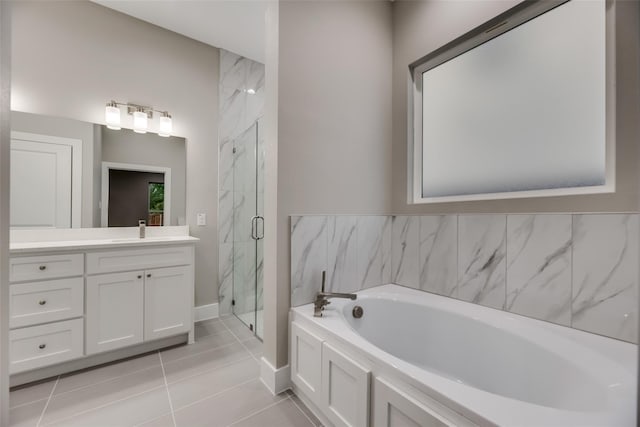 bathroom featuring separate shower and tub, tile patterned flooring, and vanity