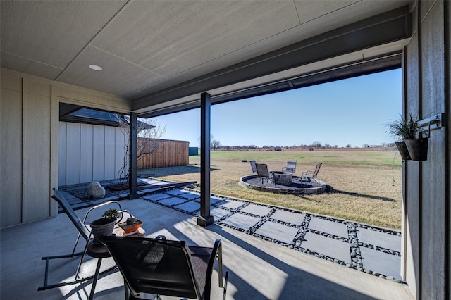 view of patio featuring a fire pit and a rural view