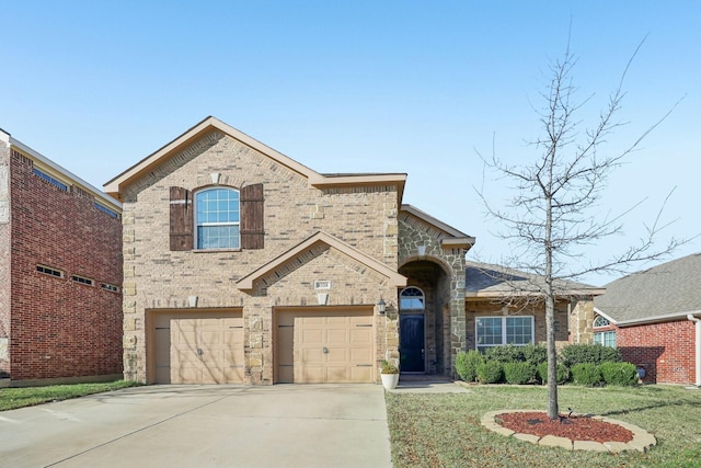 view of front facade with a front yard and a garage