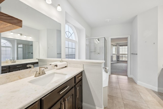 bathroom with tile patterned floors, vanity, and a shower with shower door