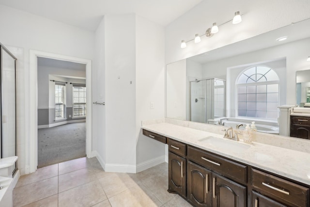 bathroom featuring tile patterned floors, vanity, and plus walk in shower