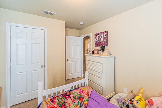 bedroom with light carpet