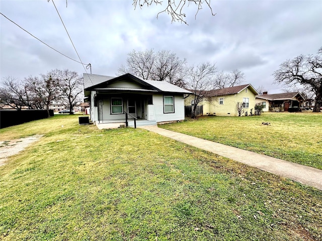 view of front of property with a front yard and a porch