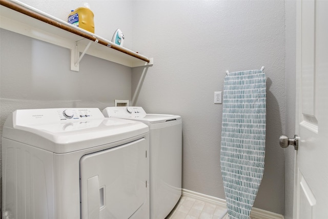 laundry room with washer and clothes dryer