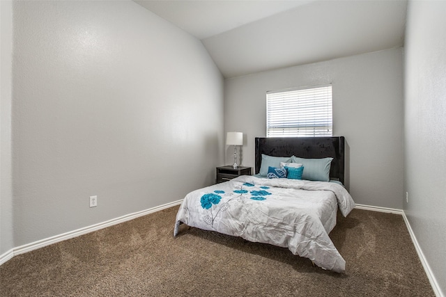 carpeted bedroom featuring lofted ceiling