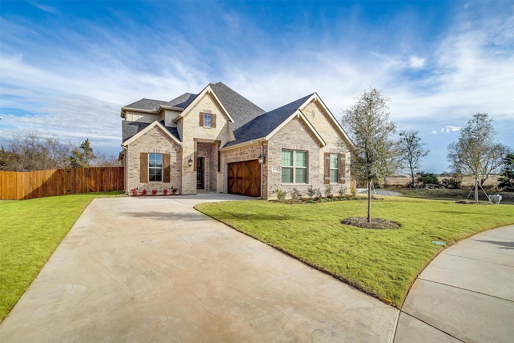 craftsman-style home with a front yard and a garage