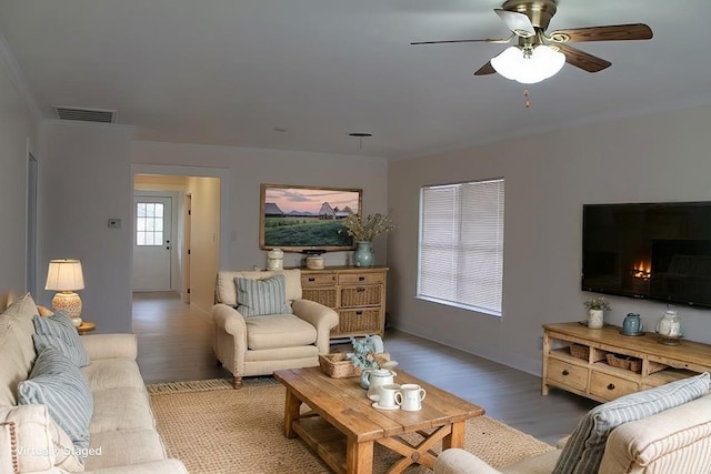 living room with light hardwood / wood-style floors and ceiling fan