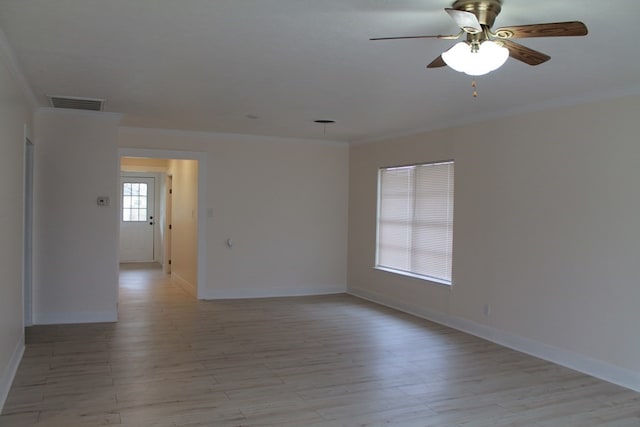 unfurnished room featuring crown molding, light hardwood / wood-style floors, and ceiling fan