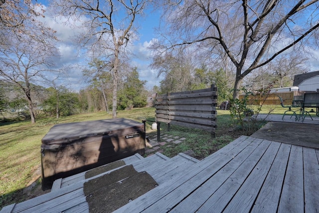 deck featuring a hot tub