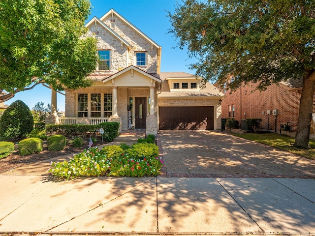 craftsman-style home with a porch and a garage