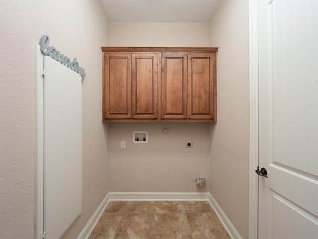 laundry area with cabinets, hookup for a washing machine, and electric dryer hookup