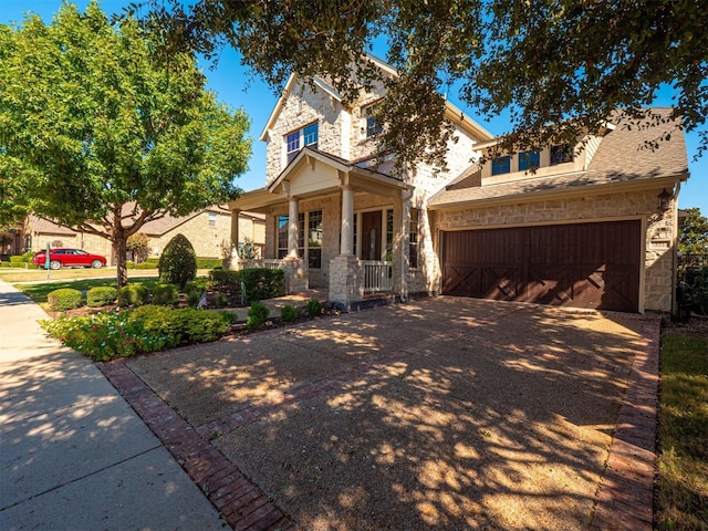 view of front of property with covered porch and a garage