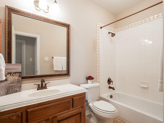 full bathroom featuring vanity, toilet, and tiled shower / bath