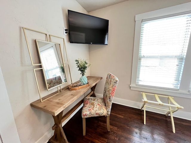 office featuring lofted ceiling and dark hardwood / wood-style floors