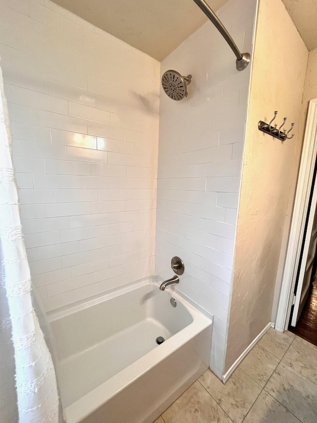 bathroom featuring tile patterned flooring and shower / bath combination with curtain