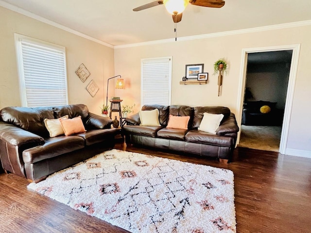 living room with crown molding, ceiling fan, and dark hardwood / wood-style floors