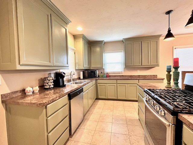 kitchen with appliances with stainless steel finishes, crown molding, sink, decorative light fixtures, and light tile patterned flooring