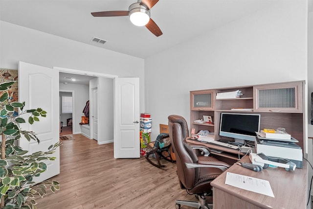 office space with ceiling fan and light hardwood / wood-style floors