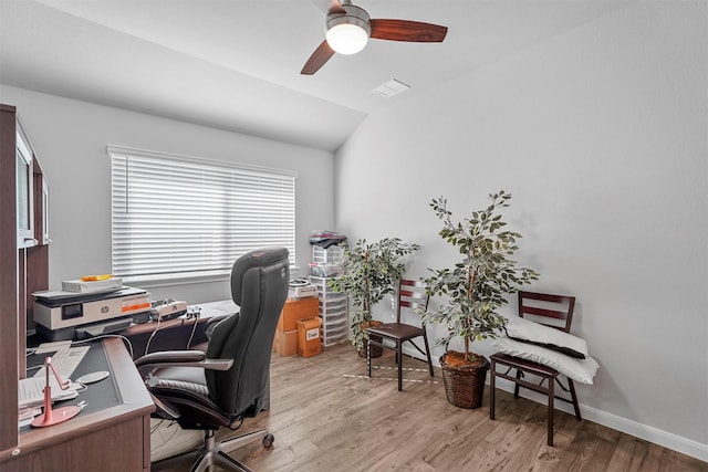 office area with light wood-type flooring, ceiling fan, and lofted ceiling