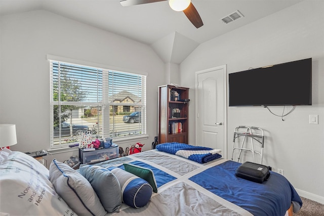 bedroom with multiple windows, ceiling fan, carpet floors, and vaulted ceiling