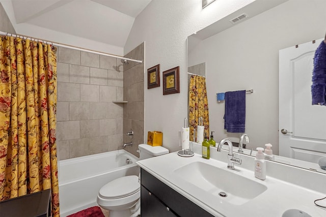 full bathroom with shower / bath combination with curtain, vanity, toilet, and vaulted ceiling