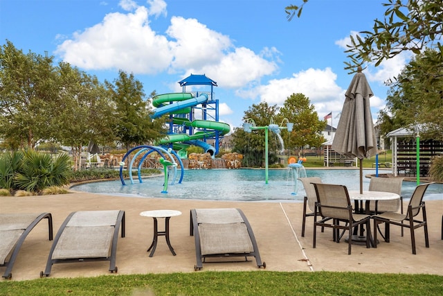 view of pool with pool water feature and a patio area