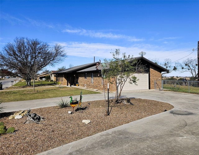 view of front of property with a front yard and a garage