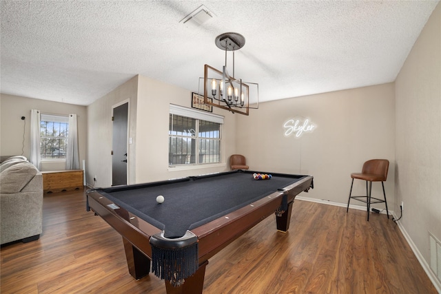 game room with hardwood / wood-style flooring, a textured ceiling, and billiards