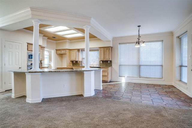 kitchen with pendant lighting, decorative backsplash, light stone counters, light brown cabinetry, and light colored carpet