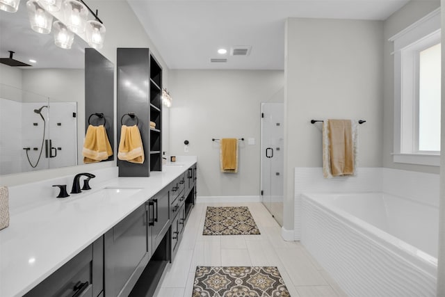 bathroom featuring vanity and shower with separate bathtub