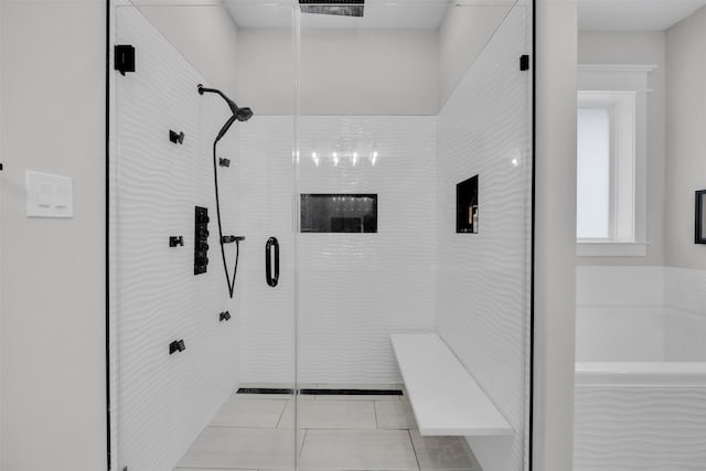 bathroom featuring tile patterned flooring and independent shower and bath