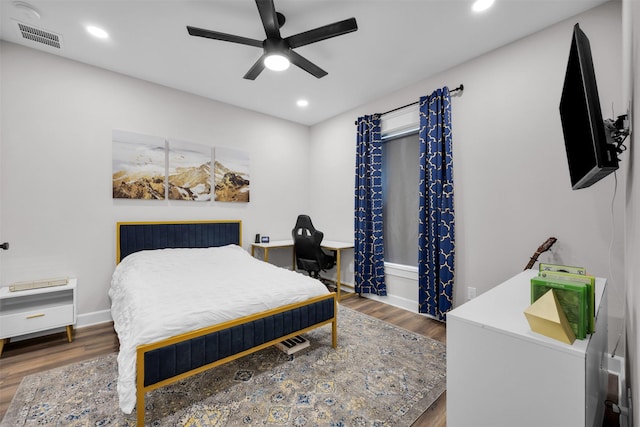 bedroom with ceiling fan and dark hardwood / wood-style floors